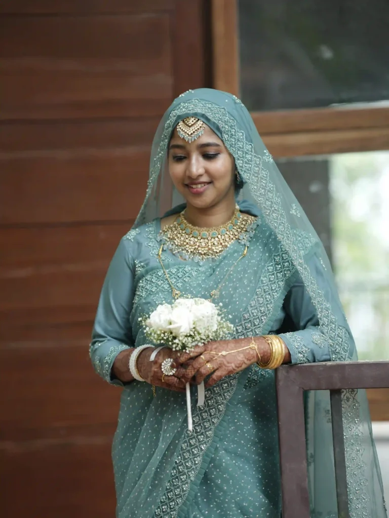 Bride in elegant light green wedding dress at traditional ceremony – Lights of Love event management company in Palakkad