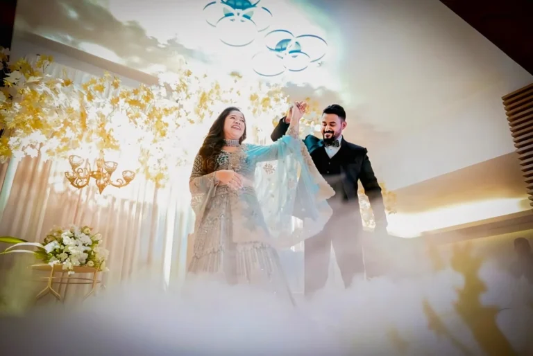 Couple enjoying a magical wedding dance with elegant stage decor, beautifully arranged by Lights of Love, a premium event management company in Palakkad.